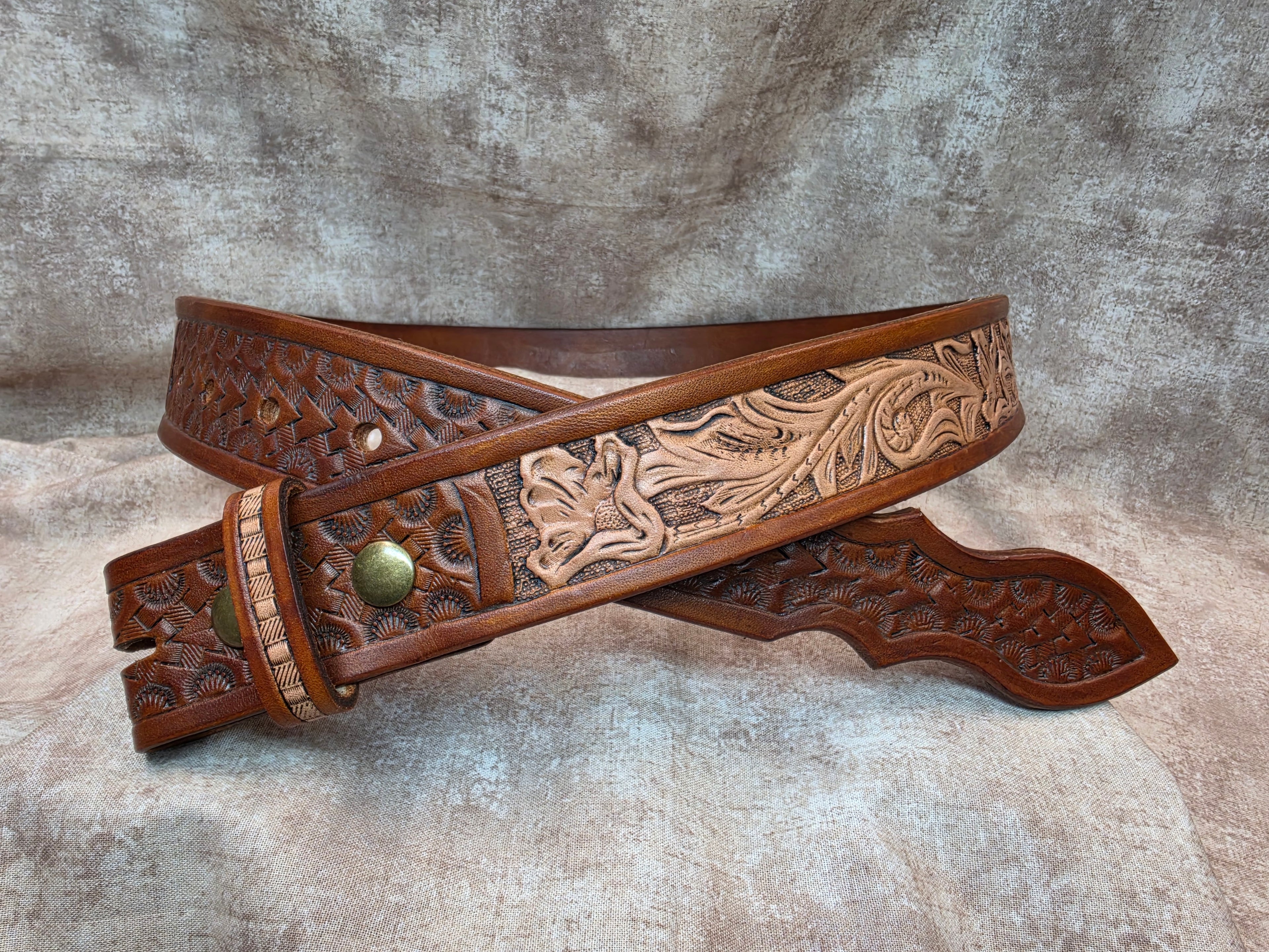 Hand tooled, golden brown, western belt with novelty tip. Size 36".