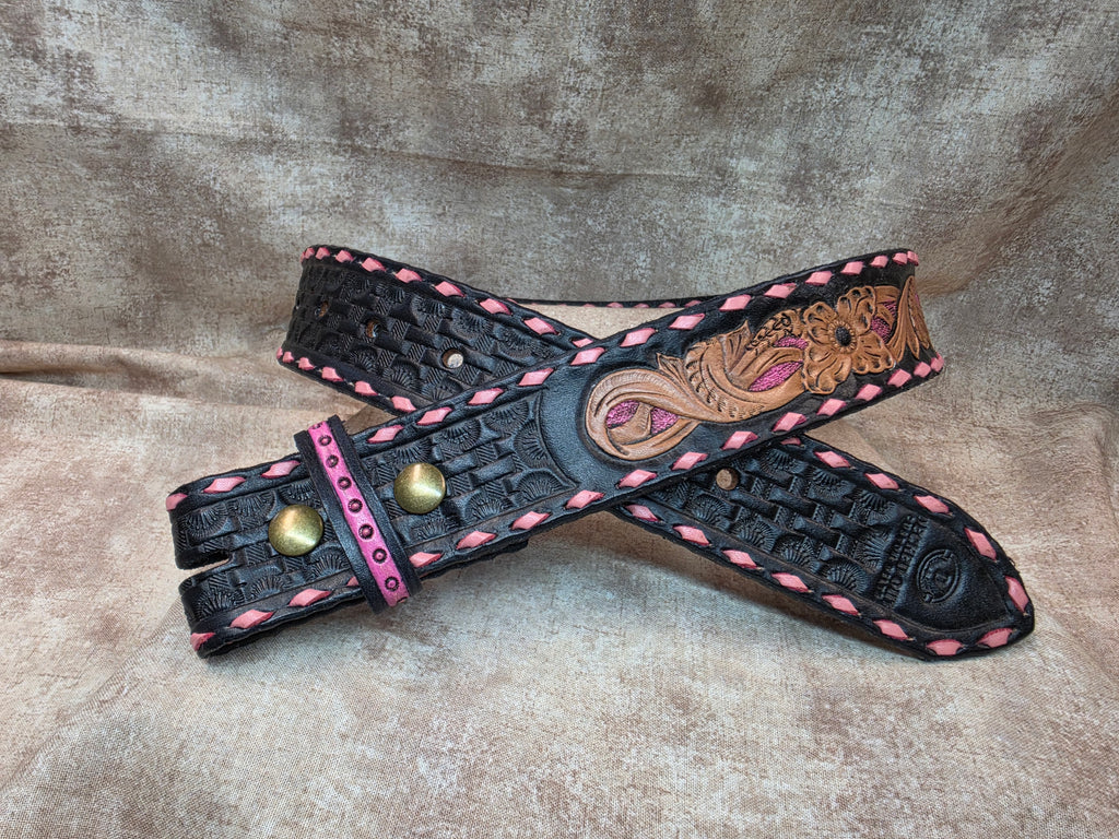 Hand tooled, black and pink buck stitched western belt. Size 28".