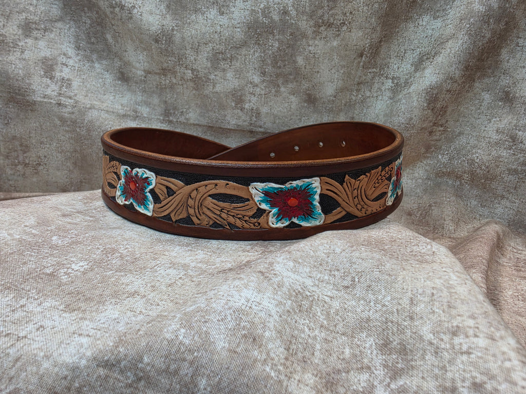 Hand tooled, golden brown, western belt with painter flowers. Size 28".
