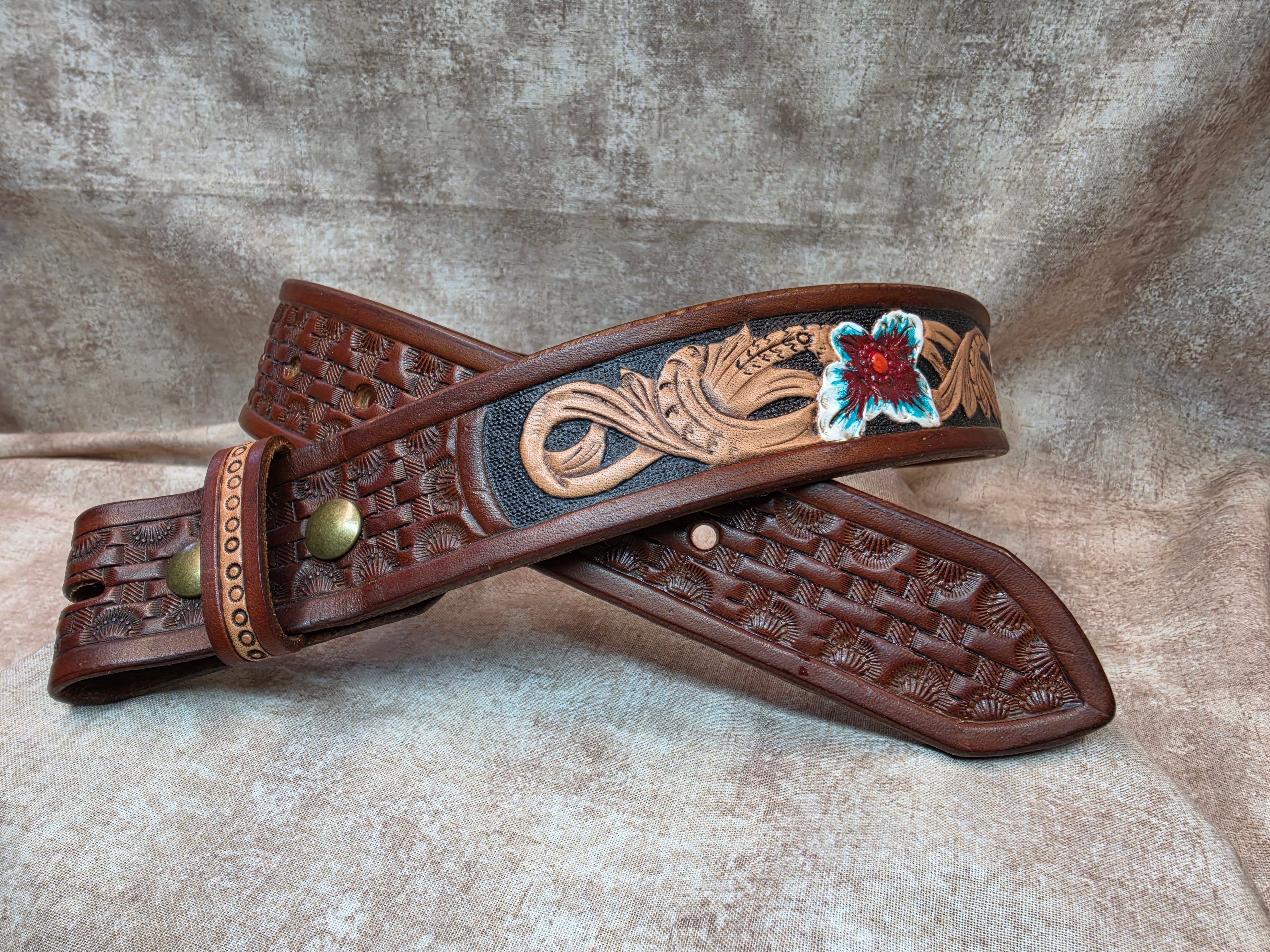 Hand tooled, golden brown, western belt with painter flowers. Size 28".