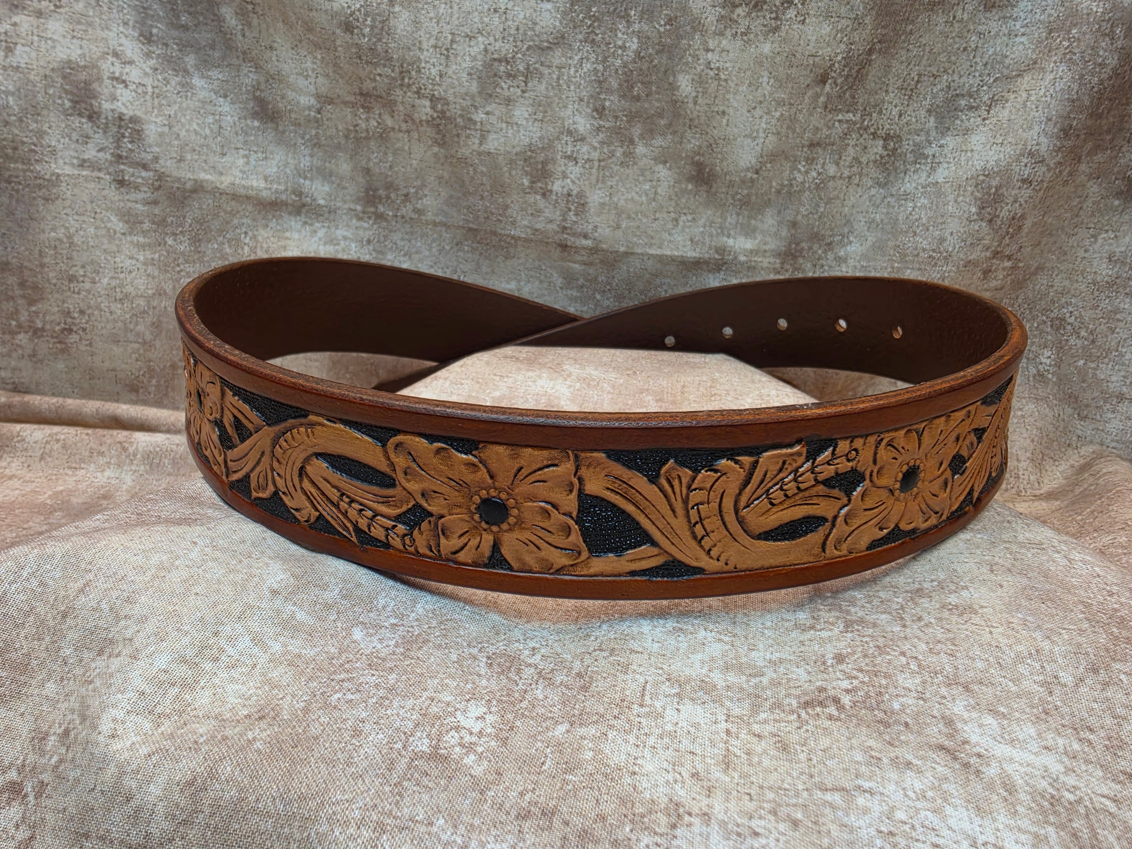 Hand tooled, golden brown, western belt with Circle R Arena logo. Size 30".