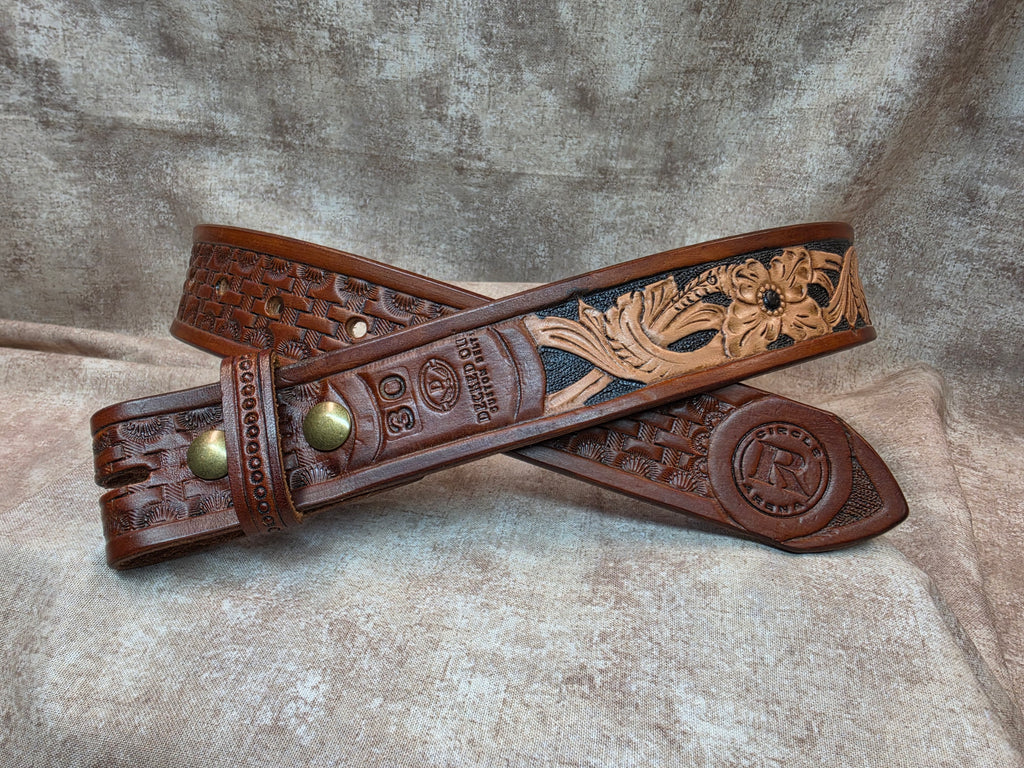 Hand tooled, golden brown, western belt with Circle R Arena logo. Size 30".