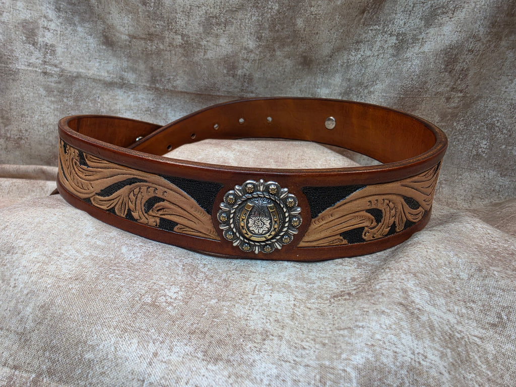 Hand tooled, golden brown, western belt with silver and gold horseshoe conchos.. Size 30".