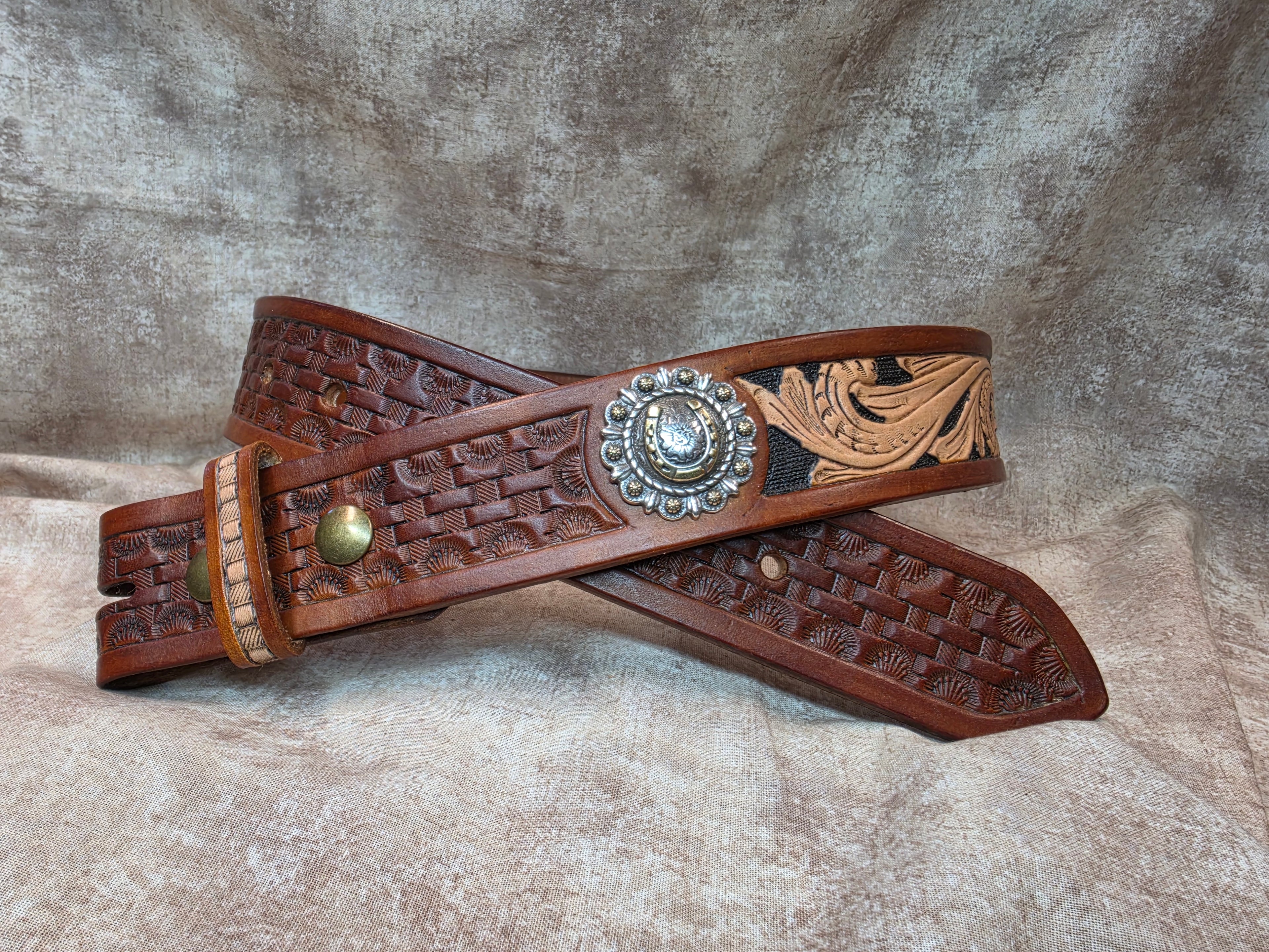 Hand tooled, golden brown, western belt with silver and gold horseshoe conchos.. Size 30".