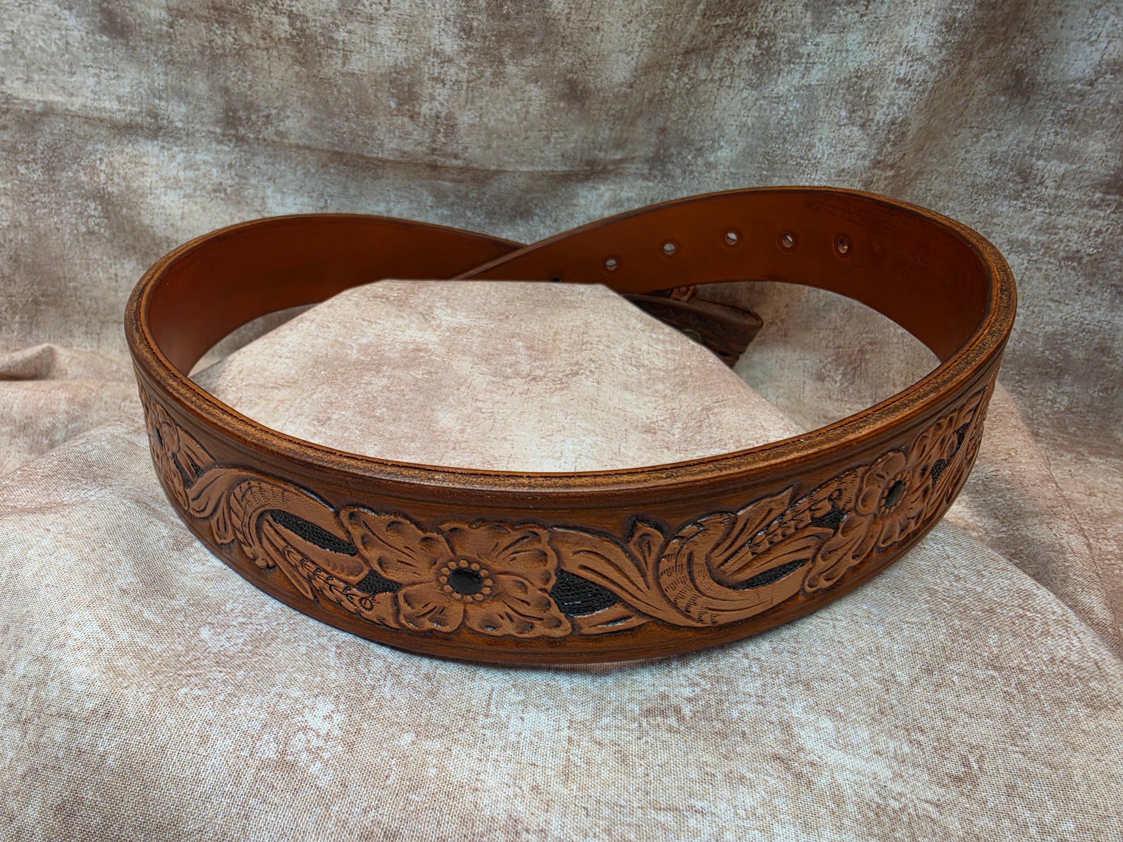 Hand tooled with Herman Oak leather, golden brown, western belt. Size 32".