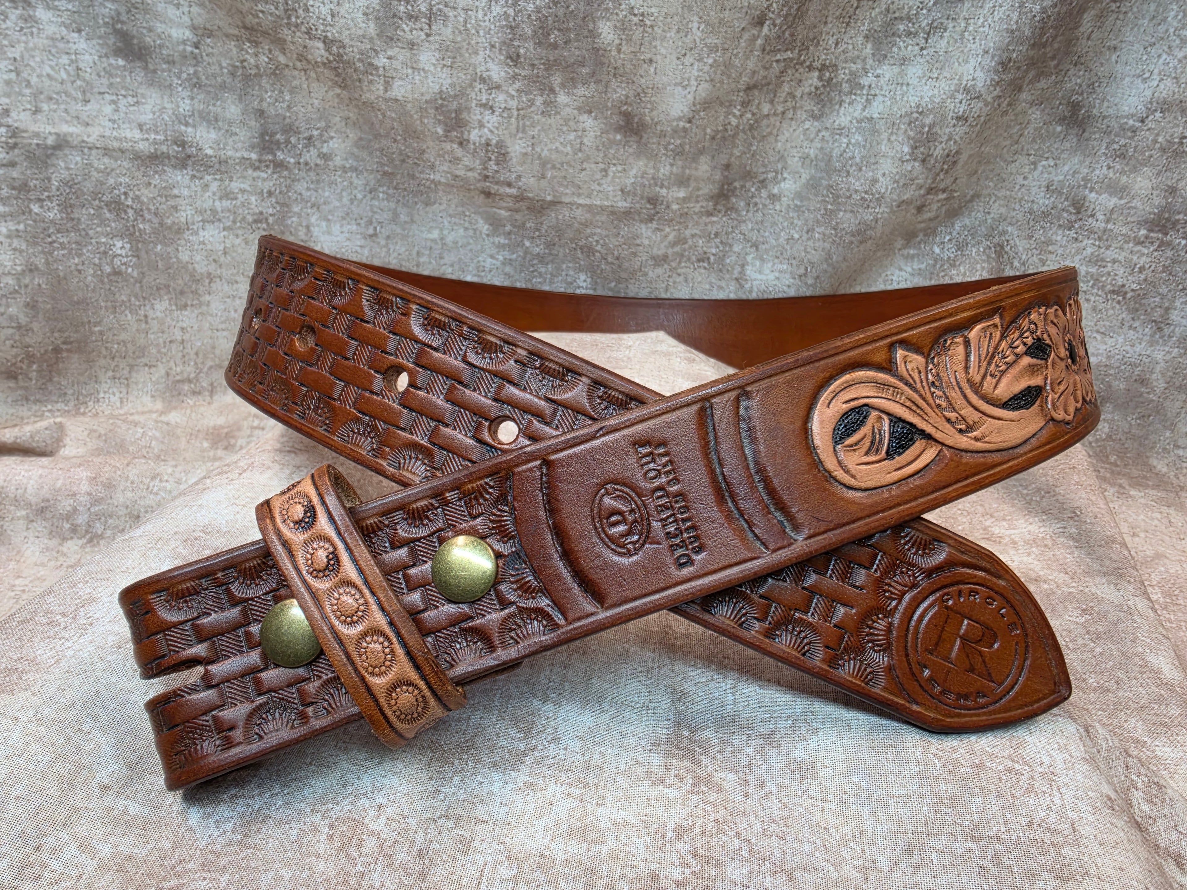 Hand tooled with Herman Oak leather, golden brown, western belt. Size 32".