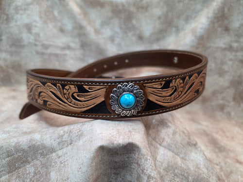 Complete hand tooled, western belt with silver and turquoise colored buckle, lined back, sewn edges, tooled keeper. Size 34".