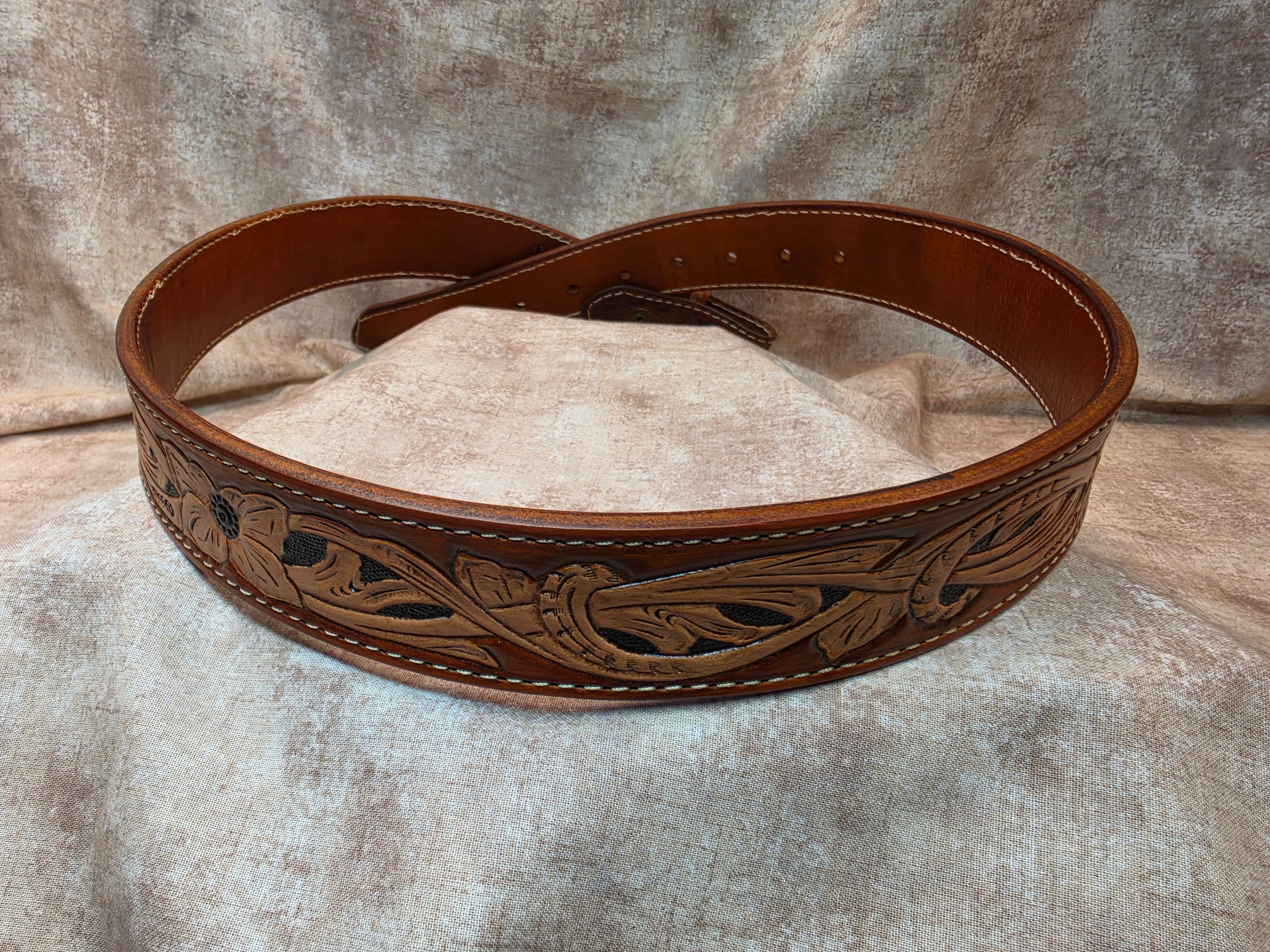 Hand tooled, golden brown, western belt. Size 36".