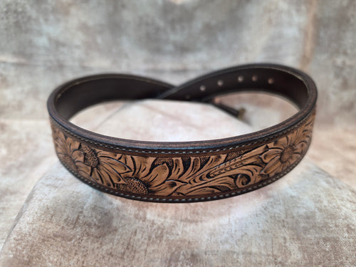 Complete hand tooled, western belt with antique brass buckle, lined back, sewn edges, tooled keeper. Size 31".