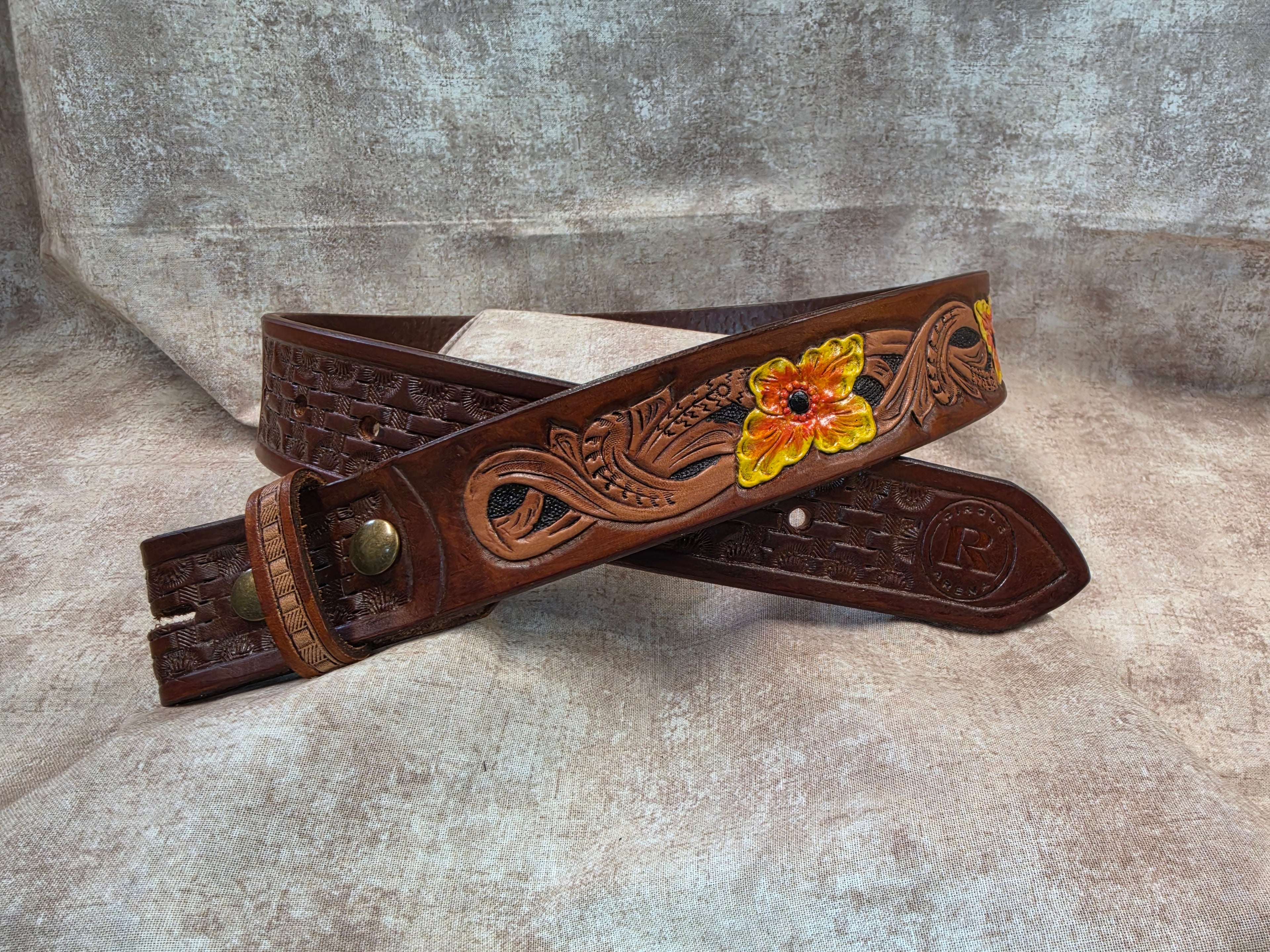 Hand tooled, western belt with painted flowers. Size 28".