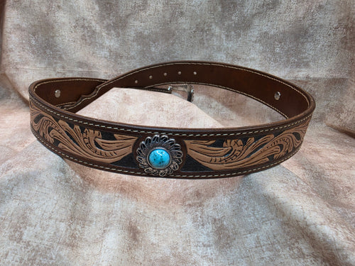 Complete hand tooled, western belt with silver and turquoise colored buckle, novelty tip, lined back, sewn edges, tooled keeper. Size 36".